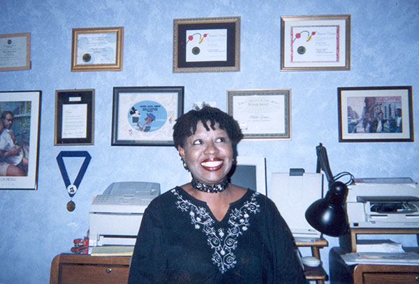 Nikki Grimes at work in her office